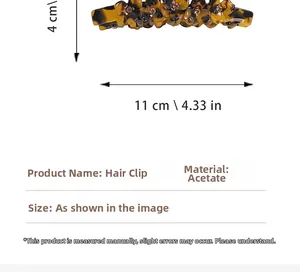 Detail of tortoise shell acetate claw clip with rhinestone flowers measuring 11cm by 4cm