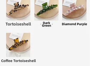 Close-up of four elegant acetate hair claws in beige, green, purple, and coffee patterns