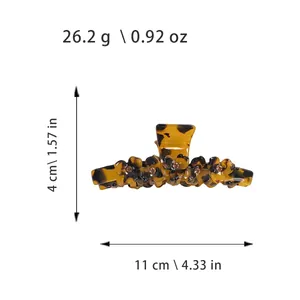 Tortoiseshell acetate hair claw clip with floral rhinestones, 11cm length shown on white base
