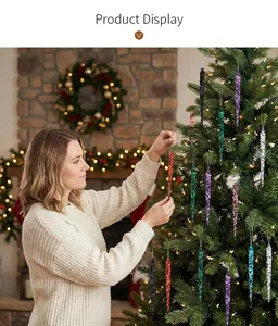 Hanging colorful acrylic icicle ornaments on a Christmas tree for festive decoration