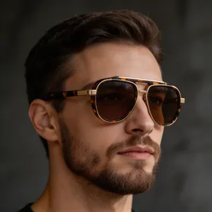 Close-up of tortoise aviator sunglasses with gold double bridge on male model face