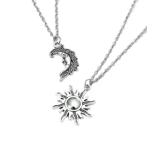 Retro sun and moon pendant necklace set with vintage silver finish on white background