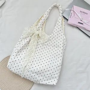 Large polka dot canvas tote bag with delicate lace bow detail