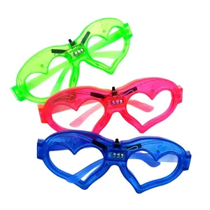 Three-pack LED heart shaped glowing glasses in green pink and blue for 2026 parties