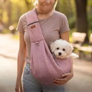 Detail of pink breathable pet mesh sling carrier with adjustable strap and D-ring hook