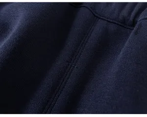 High-quality close-up detail of navy blue fabric and neat stitching on toddler girls jacket