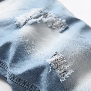 Light blue distressed denim shorts with heavy faded wash and ripped details for summer