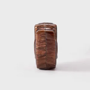 Side view of marble texture acrylic clutch bag showing the unique stepped structure design