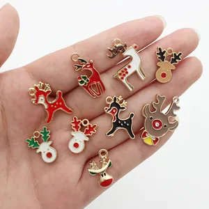 Christmas reindeer enamel charms set of 9 pieces for DIY jewelry making shown on hand