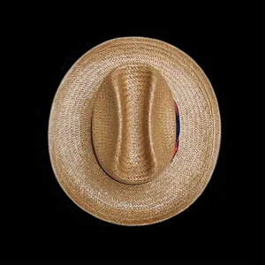 Top view of woven straw hat featuring a navy and red grosgrain ribbon band detail