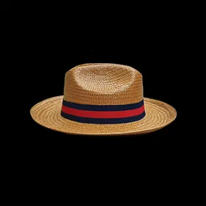 Western style straw cowboy hat with red and blue ribbon trim for summer outdoor sun shading