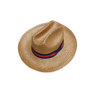 Western straw cowboy hat with stylish red and blue ribbon trim for sun protection