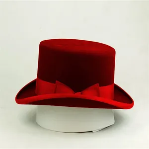 Classic red wool felt top hat for women with elegant ribbon bow decoration on a stand