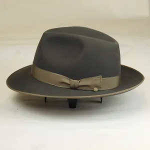 Classic dark grey wool felt fedora hat featuring a brown ribbon and decorative trim