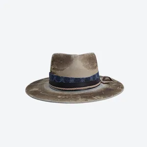 Detail of vintage wool fedora hat with multi-layered decorative bands and distressed finish