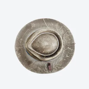 Top-down view of a vintage wool felt fedora showing distressed brown texture and crown detail