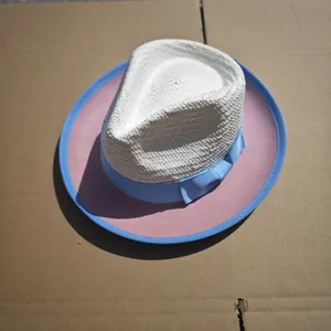 Close-up of wool felt and straw patchwork fedora hat with blue ribbon and contrast binding