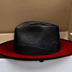 Classic black straw fedora hat with a red underside and a ribbon bow decoration