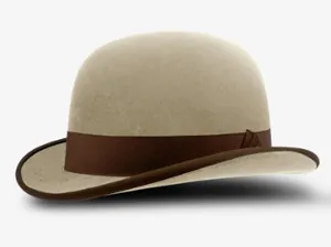 Detailed side view of beige wool felt bowler hat with dark brown satin ribbon and trim