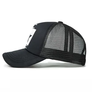 Side view of black trucker hat with star print and breathable mesh material