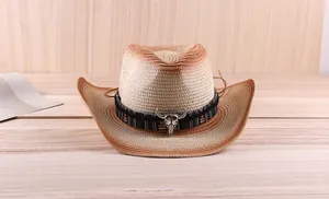 Detail of western cowboy straw hat featuring ethnic band and silver bull skull accessory