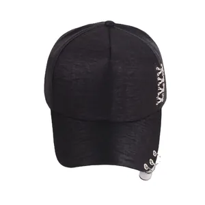 Black hip hop baseball cap with metallic rings and punk style decorative pins