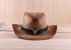 Detail of western straw hat with gradient weave and metallic bull skull ornament