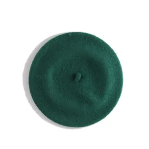 Top view of dark green wool beret hat showing texture and stem detail for girls