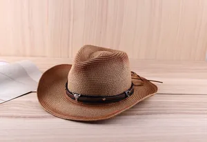 Detailed view of western straw hat with leather band and embossed bull head buckle