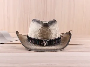 Close-up of gradient straw cowboy hat with ethnic band and silver bull skull accessory
