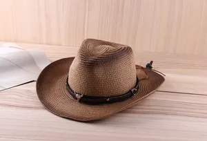 Detail of woven straw cowboy hat with bull head pendant and adjustable chin strap