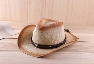 Detail of straw cowboy hat featuring metal bull head ornament and black woven band