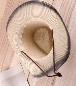 Close-up of woven straw hat interior with adjustable drawstring and gradient texture