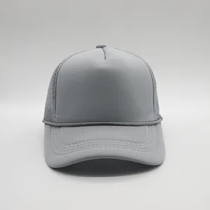 Detailed view of dark grey trucker hat with breathable mesh back and decorative rope