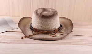 Detail of gradient straw cowboy hat showing intricate weaving and brown decorative band