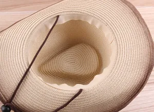 Close-up of woven straw hat interior with sweatband and adjustable windproof cord