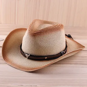 Western straw cowboy hat with bull head badge and gradient weave design on wood background