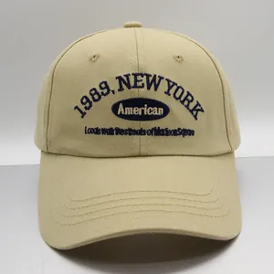 Detailed macro of the blue 1989 New York embroidery on this khaki cotton baseball cap