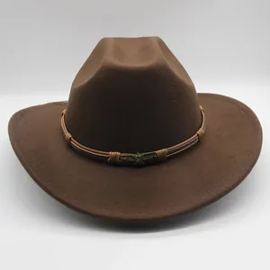 Close-up of brown wool western cowboy hat with leather band and metal skull badge