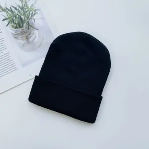 Classic black ribbed knit beanie for kids and adults in soft winter thermal fabric