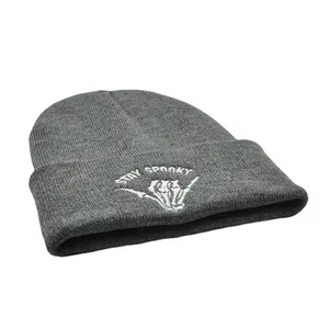 Dark grey knitted beanie with Stay Spooky white embroidery and skull hand design