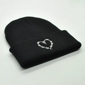Winter black knit beanie with heart embroidery for outdoor warmth and street style