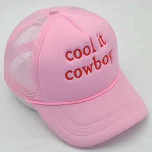 Pink mesh trucker hat for women with red embroidered cool it cowboy text and curved brim