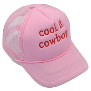 Pink mesh trucker hat with red Cool It Cowboy embroidery and adjustable foam front