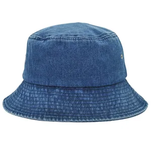Detail of dark blue denim bucket hat showing stitching lines and metal eyelets
