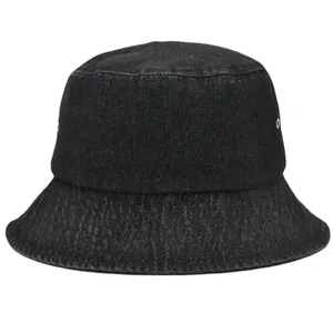 Close-up of black denim bucket hat texture featuring metal air vents and durable fabric