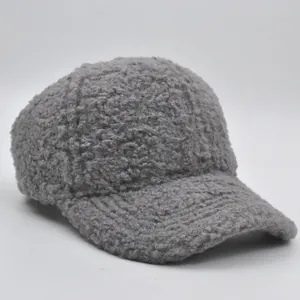 Detailed macro view of dark grey thick sherpa fleece fabric texture on a kids baseball cap