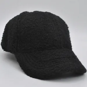 Detail of black faux lamb wool fabric on children's baseball cap for winter warmth