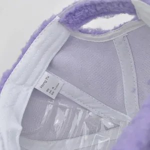 Detail of purple lamb wool baseball cap showing inner cotton lining and washing label