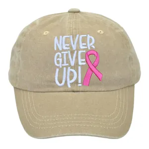 Close-up of pink ribbon and Never Give Up embroidery on washed cotton baseball cap